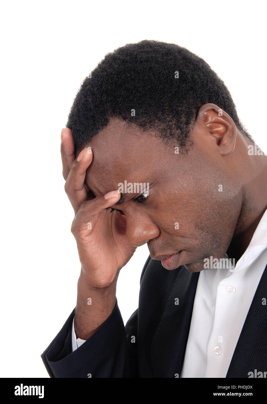 Depressed African man with hand on face Stock Photo