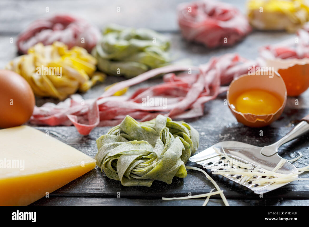 Homemade colored pasta, cheese and egg yolk Stock Photo Alamy