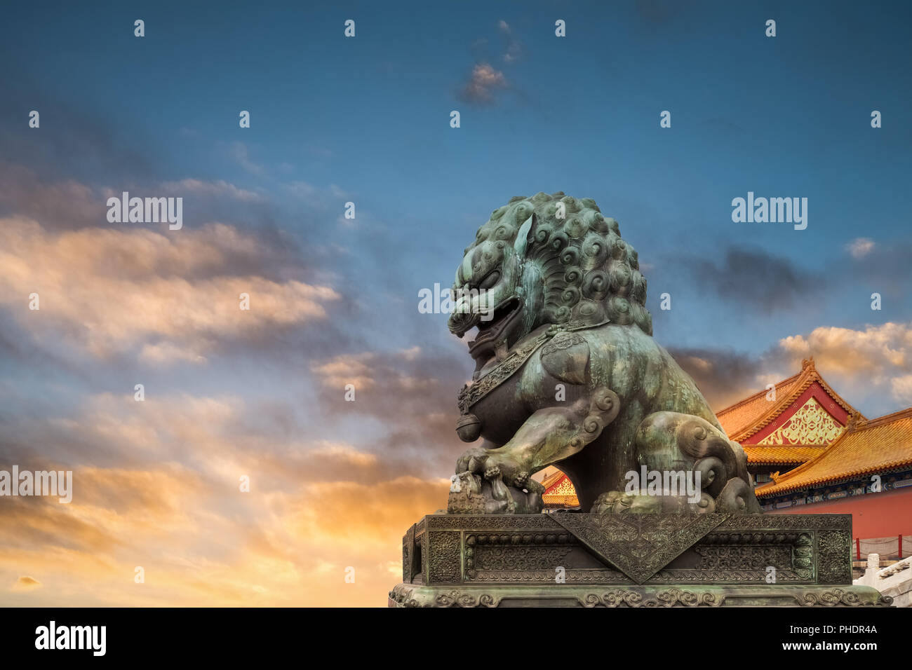 china bronze lion in sunset Stock Photo