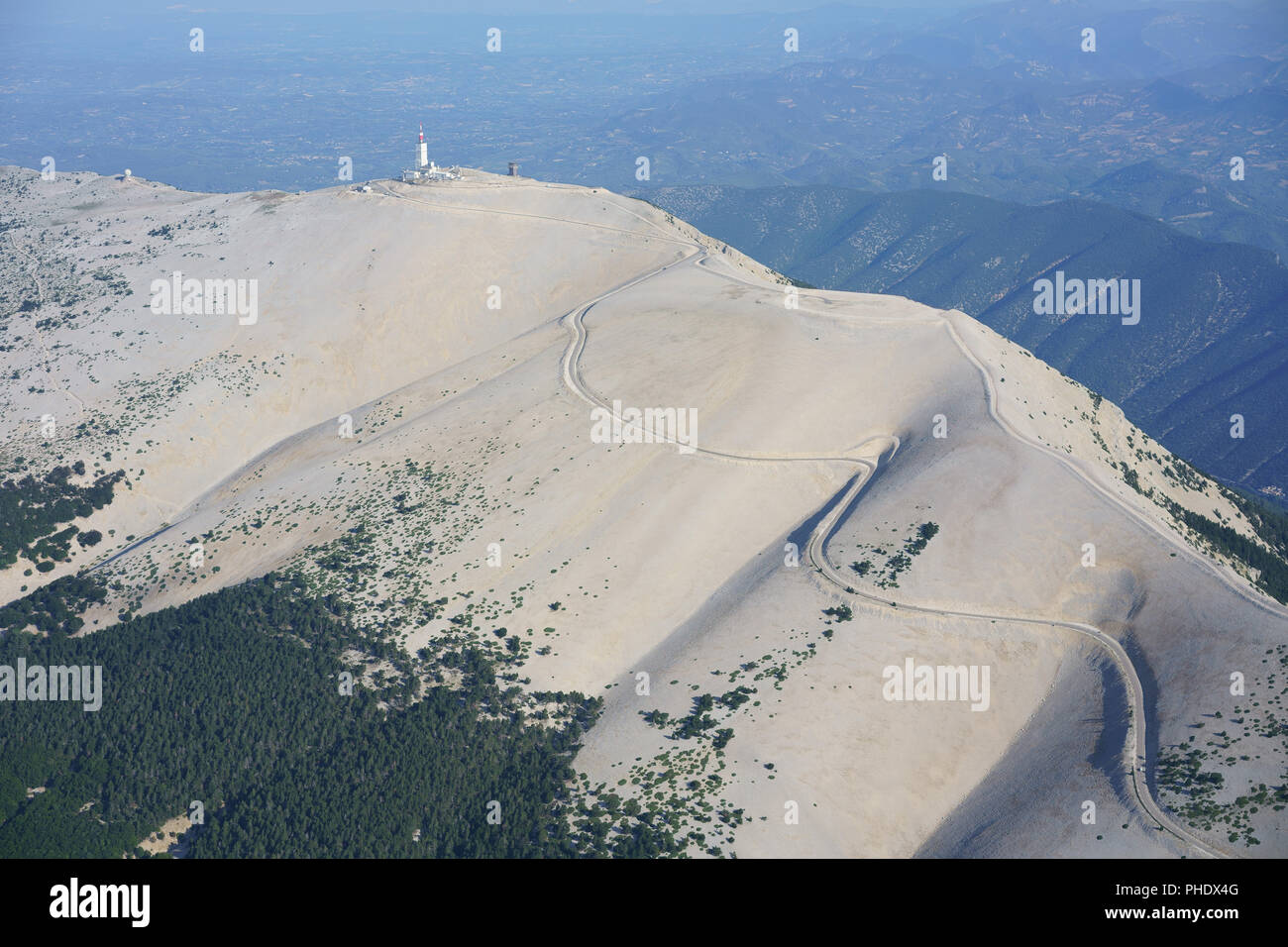 AERIAL VIEW. Barren summit of Mont Ventoux with its trademark of white limestone rocks. Bédoin, Vaucluse, Provence-Alpes-Côte d'Azur, France. Stock Photo