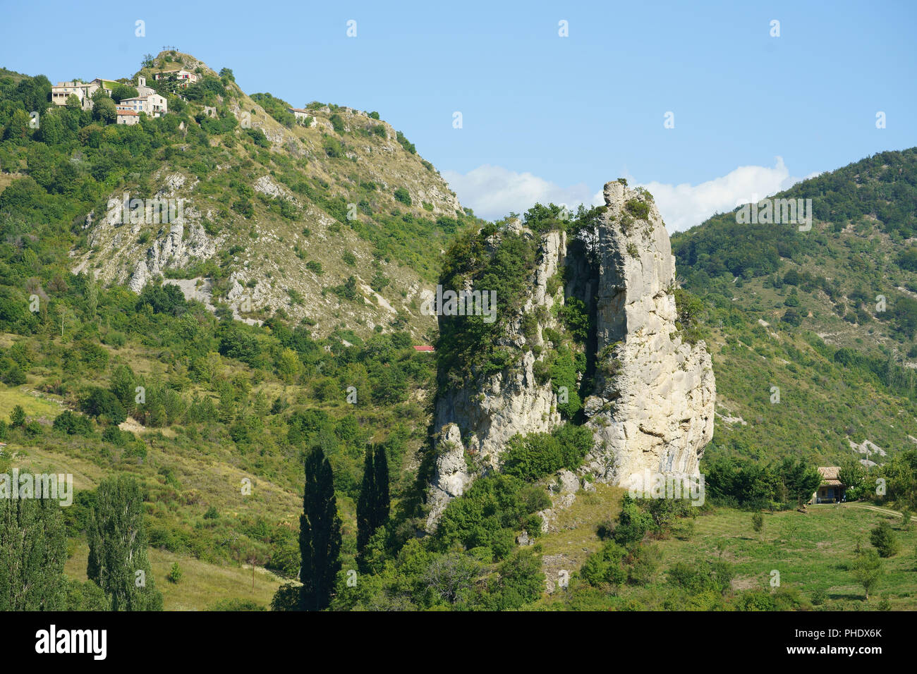 Perched medieval village of Barret de Lioure overlooking a large limestone butte. Montbrun-les-Bains, Drôme, Auvergne-Rhône-Alpes, France. Stock Photo