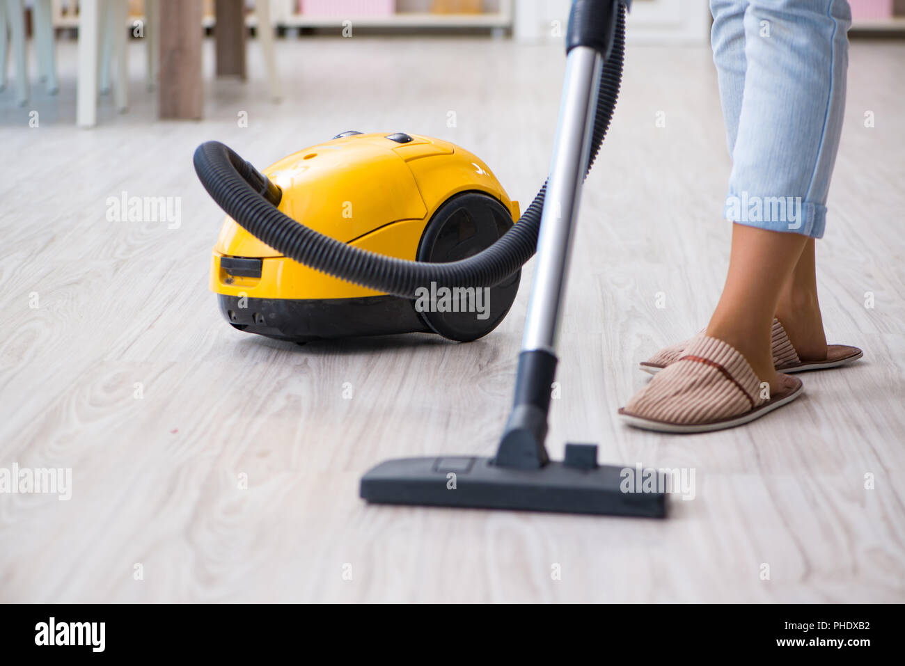 Woman doing cleaning at home with vacuum cleaner Stock Photo Alamy
