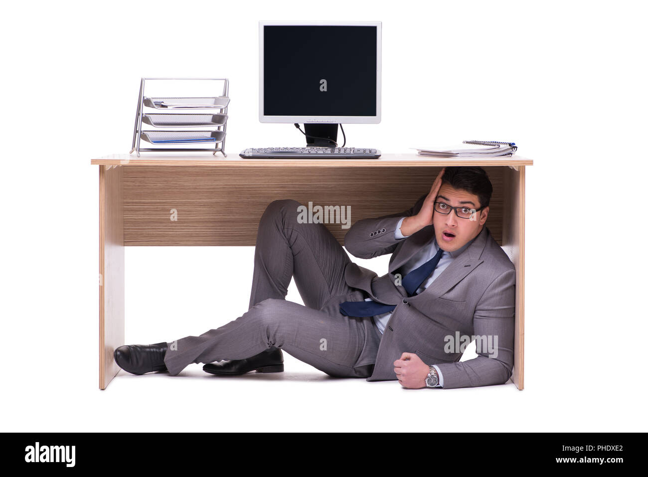 Person hiding under desk hi-res stock photography and images - Alamy