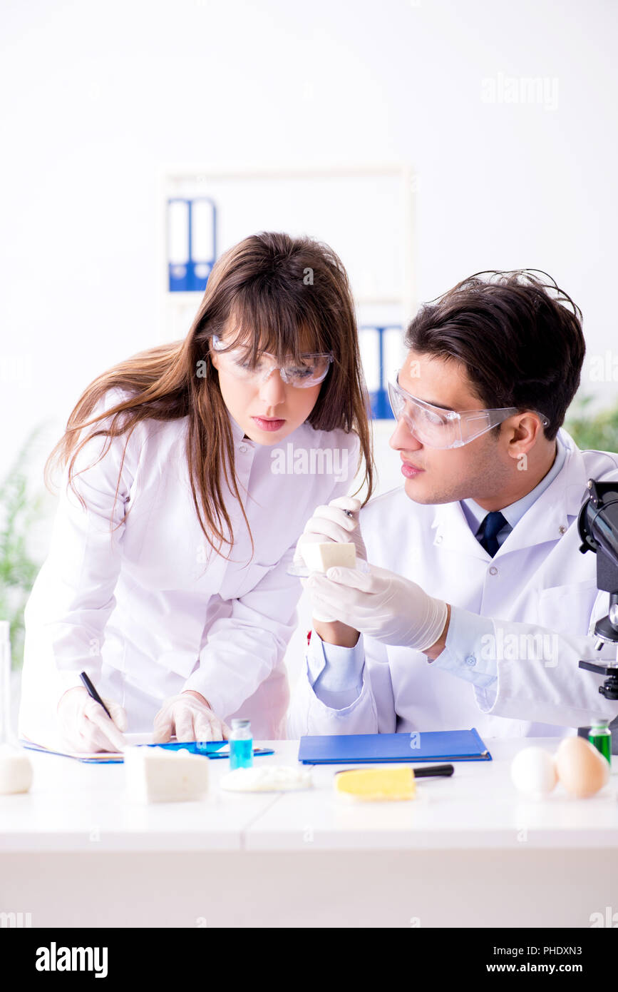 Two lab doctor testing food products Stock Photo - Alamy