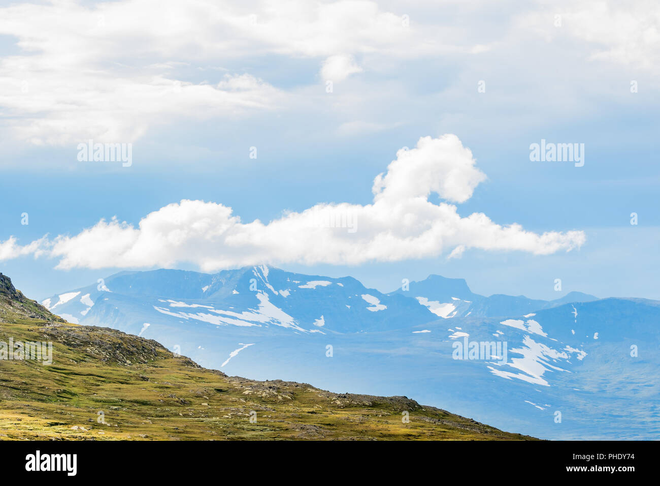 Cloud formation in the sky over a mountain Stock Photo