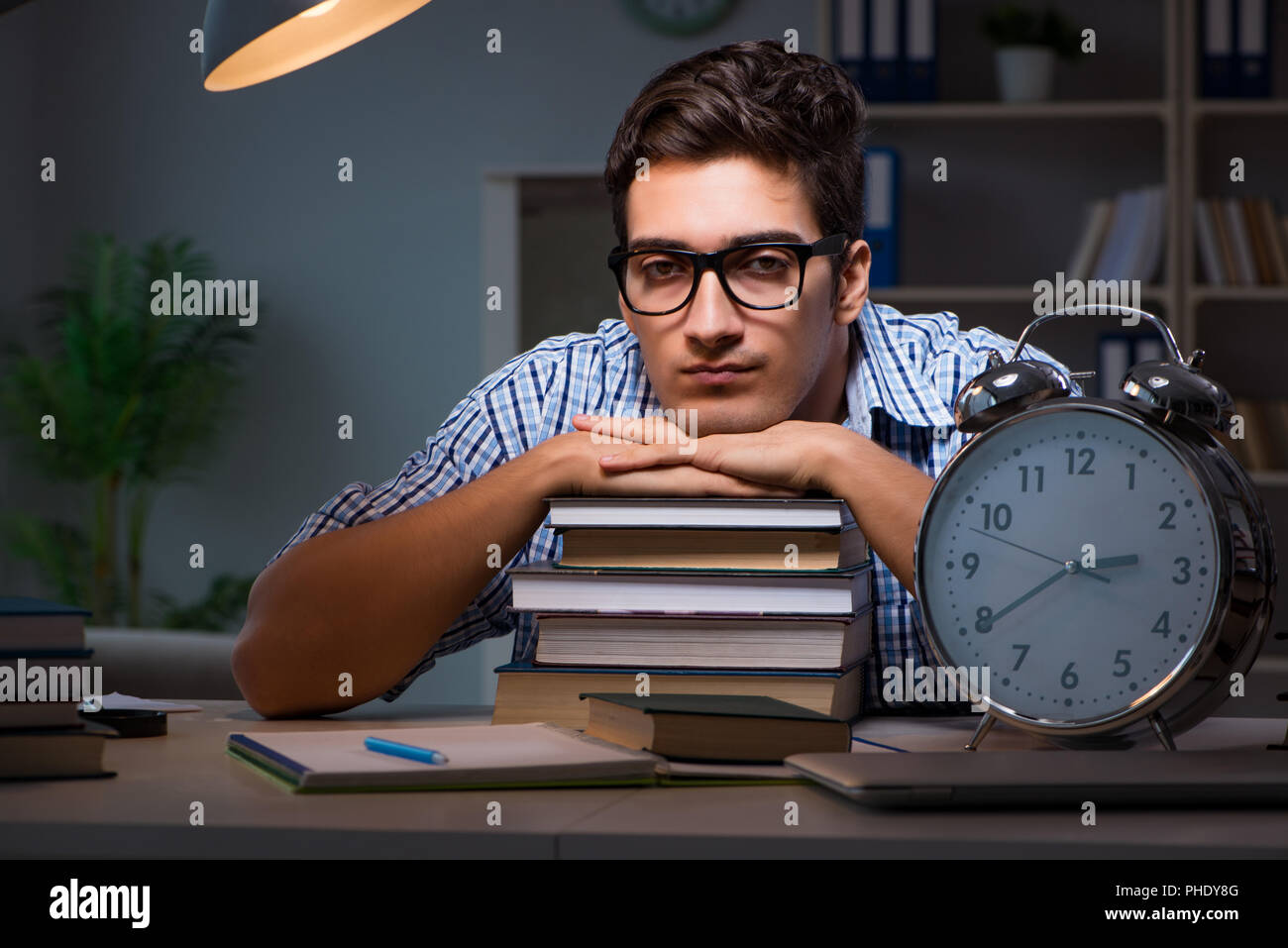 Student preparing for exams late night at home Stock Photo - Alamy