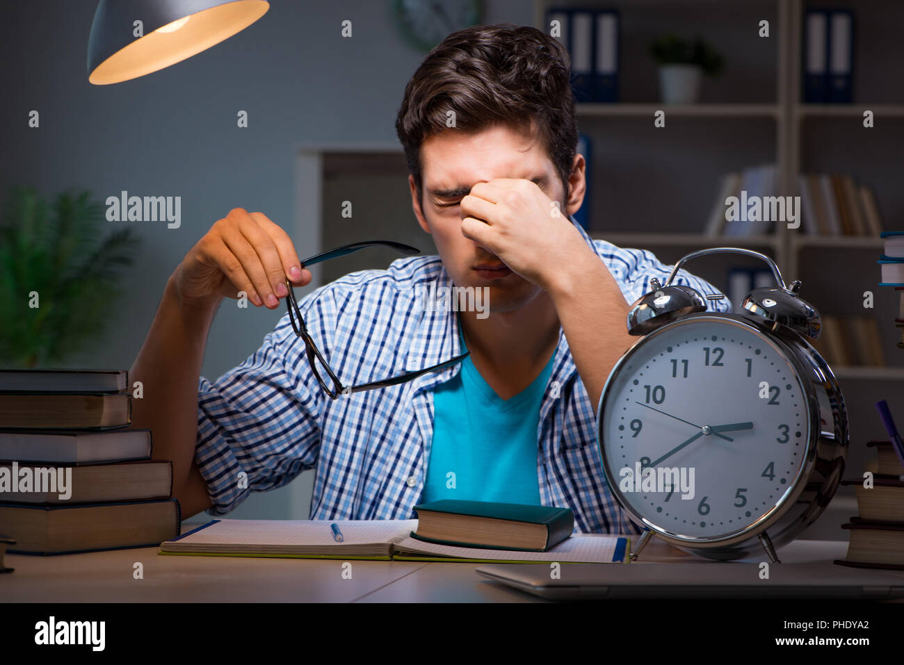 Student preparing for exams late night at home Stock Photo - Alamy