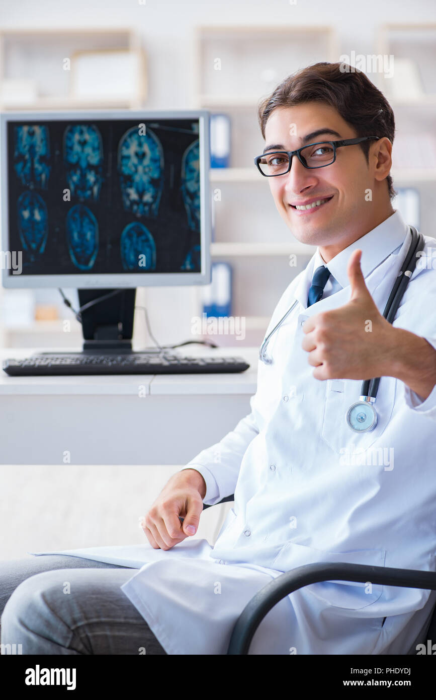 Doctor radiologist looking at x-ray images Stock Photo - Alamy