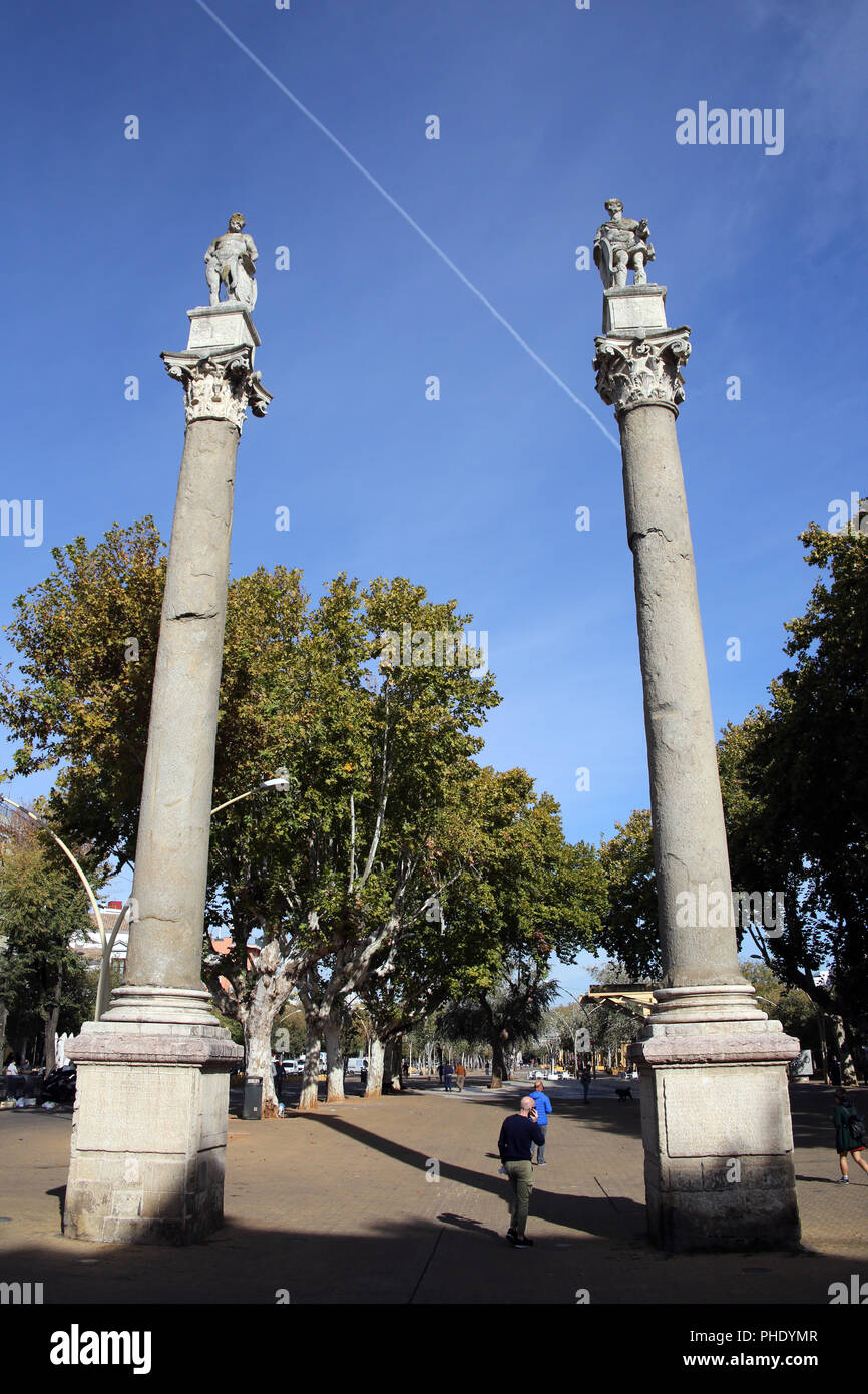 two pillars on Alameda de Hercules square Stock Photo