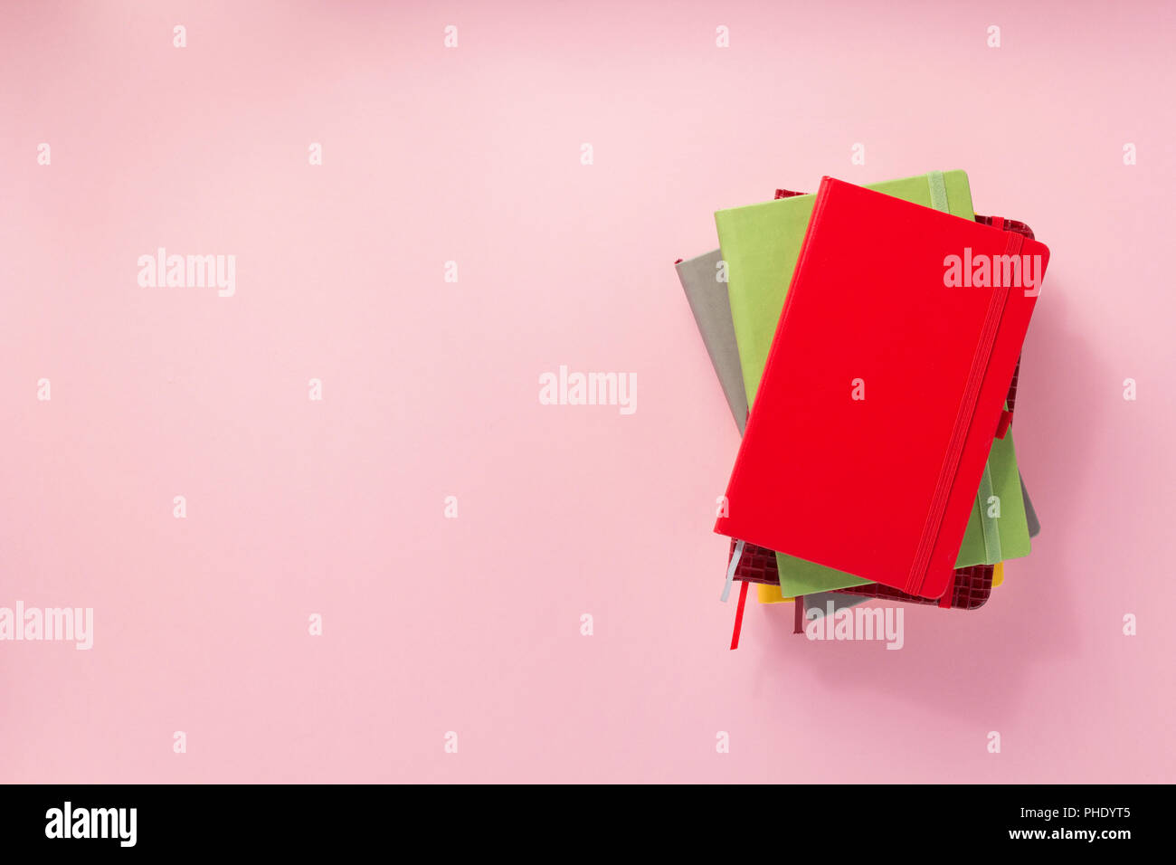 notebook and school accessories at abstract background surface Stock Photo