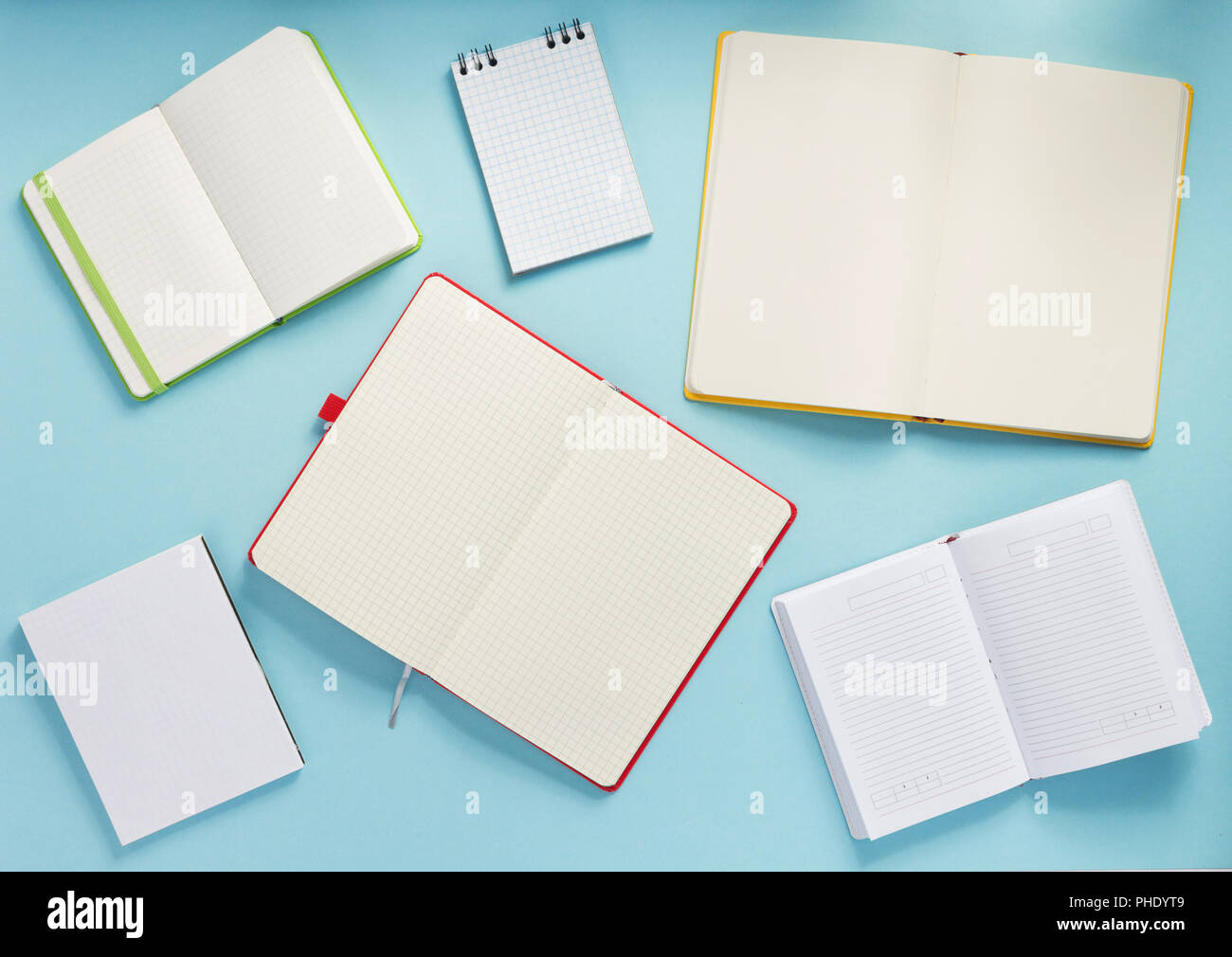 notebook and school accessories at abstract background surface Stock Photo
