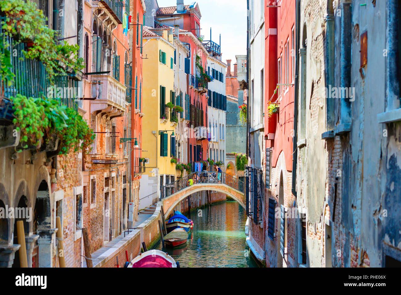 Small canal between houses in Venice Stock Photo - Alamy