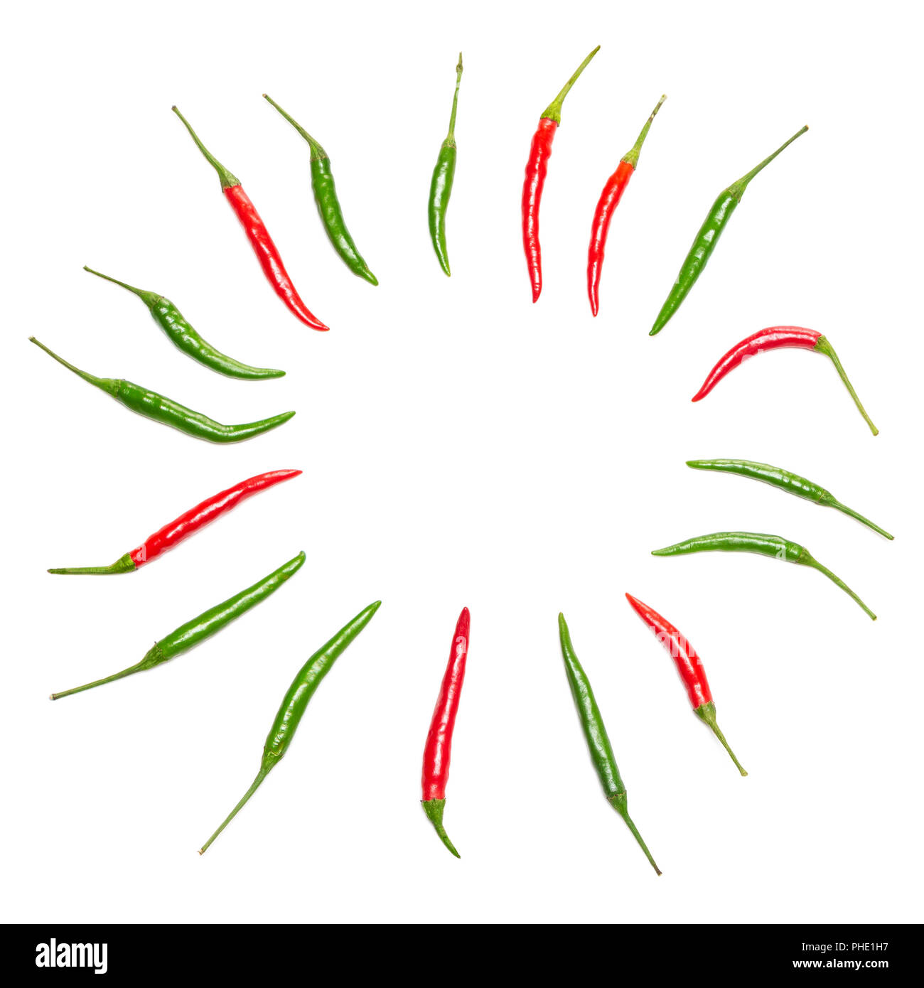 Round frame of red and green chili peppers on white background, copy ...
