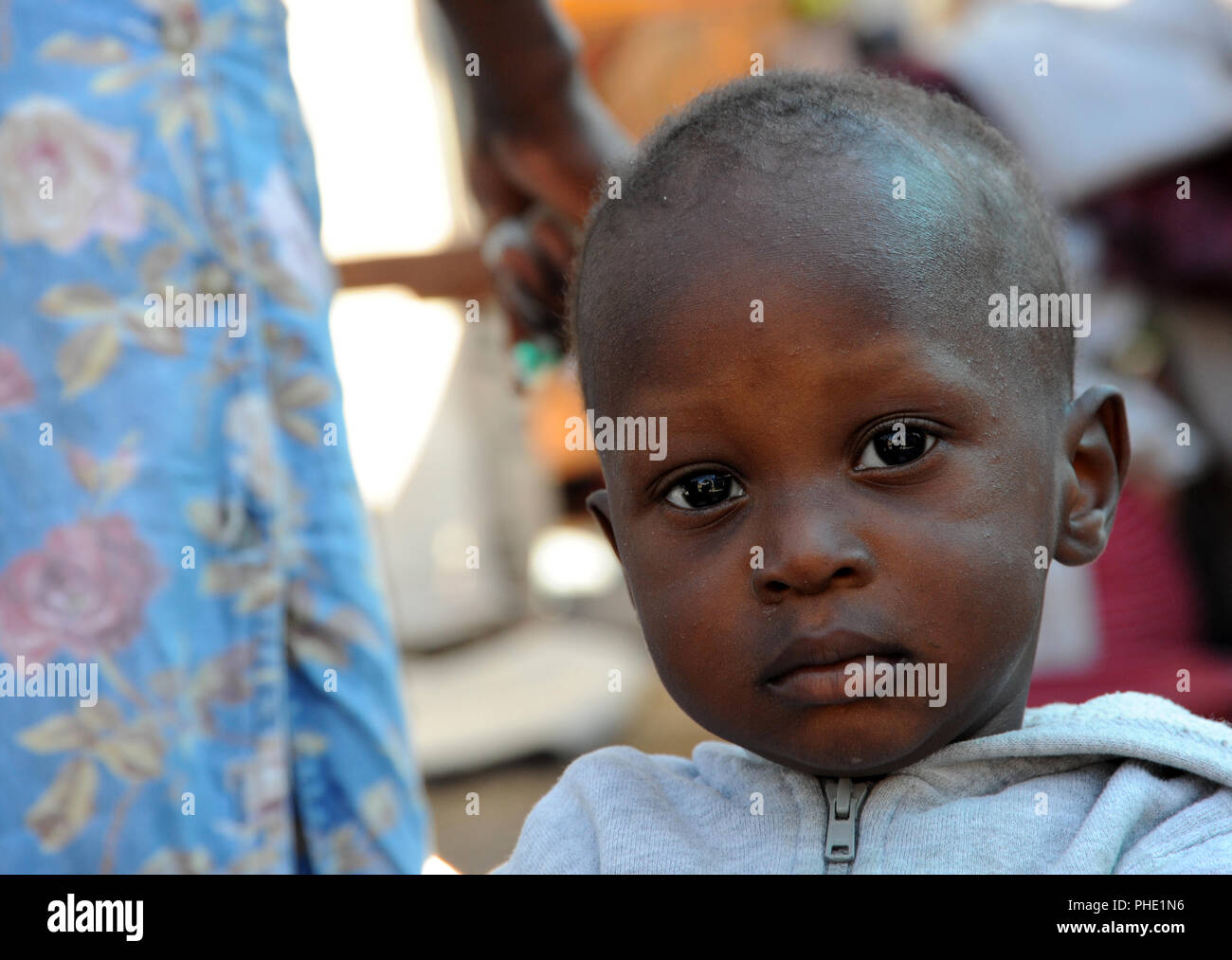 A displaced Haitians child in a tent city near, the Presidential Palace in Port au Prince, Haiti on Jan. 24, 2010. Haiti was devastated by a 7.0 magnitude earthquake on Jan. 12, 2010 Stock Photo