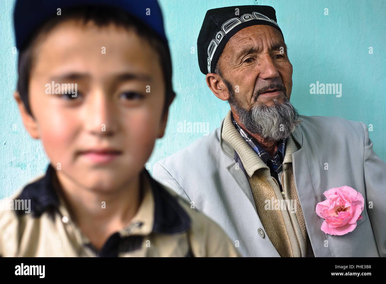 Grandfather, grandson from the Uzbek ethnic group ( Kyrgyzstan Stock ...
