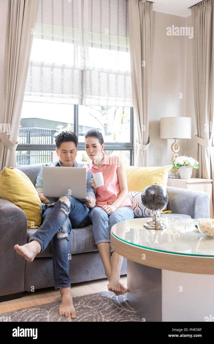 Young Couples using laptop Stock Photo