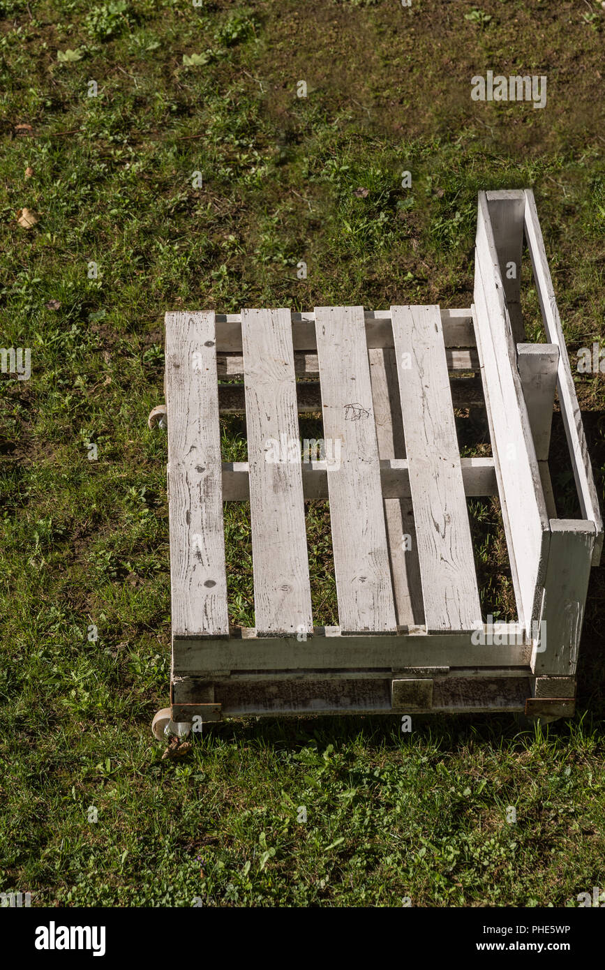 white garden bench made of europallets - upcycling Stock Photo