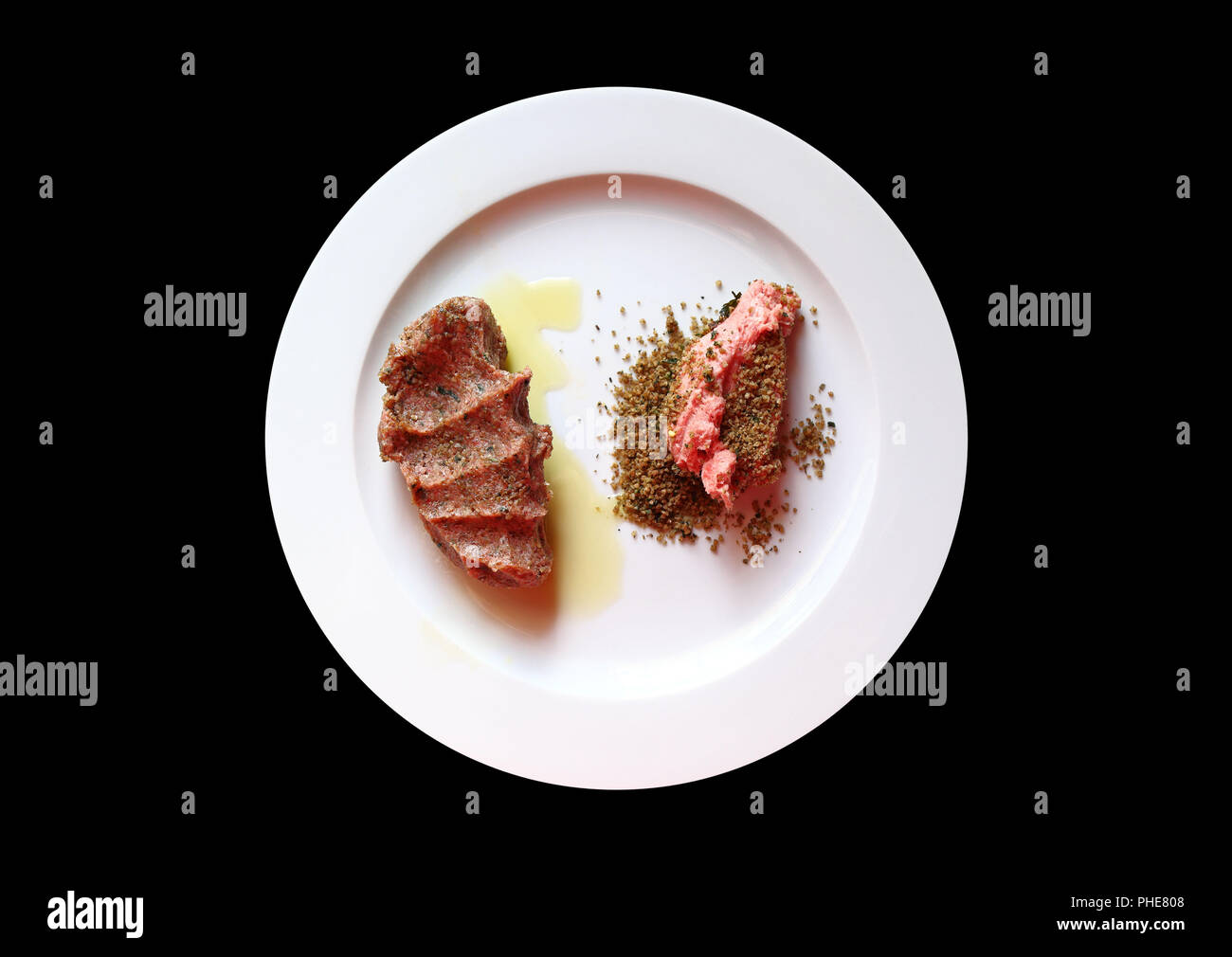 Traditional Lebanese Cuisine Raw Meat (Kibbeh) isolated on a black