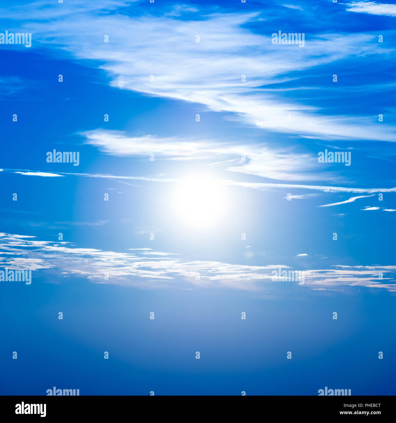 Sunset in the sky with blue clouds Stock Photo - Alamy