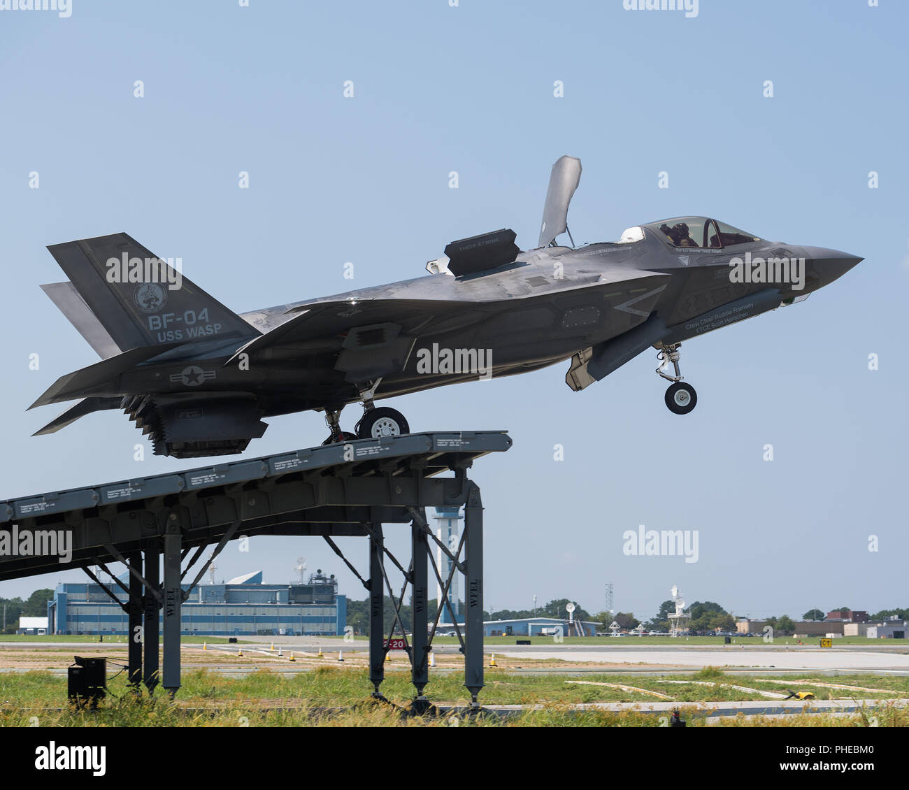 Royal Navy Cmdr. Nathan Gray and U.S. Marine Corps Maj. Michael Lippert, both F-35 Pax River ITF test pilots, conduct ski jumps and field carrier landing practices with F-35Bs on Aug. 28, 2018, at NAS Patuxent River as part of the workups for the First of Class Flight Trials aboard the HMS Queen Elizabeth.  Around 200 supporting staff from the ITF, including pilots, engineers, maintainers and data analysts, will take two F-35Bs test aircraft aboard HMS Queen Elizabeth this fall to evaluate the fifth-generation aircraft performance and integration with Royal Navy’s newest aircraft carrier. This Stock Photo