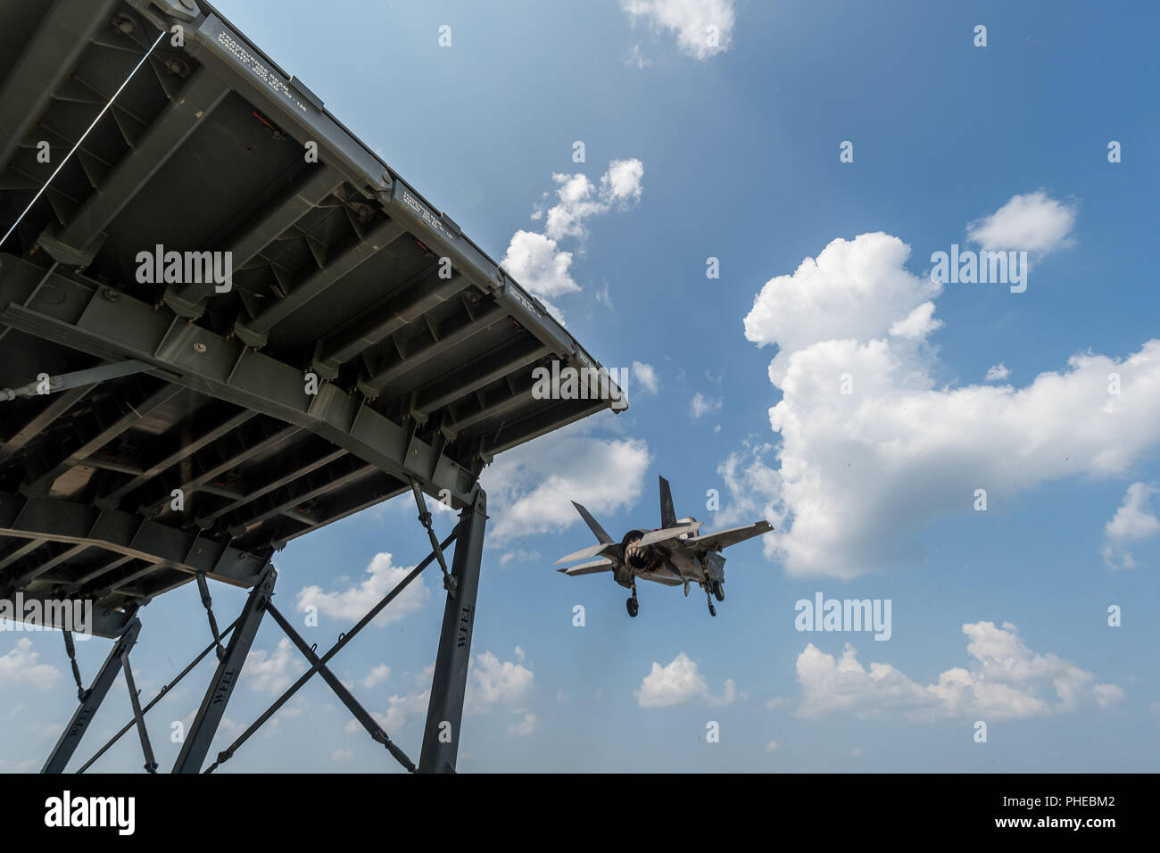 Royal Navy Cmdr. Nathan Gray and U.S. Marine Corps Maj. Michael Lippert, both F-35 Pax River ITF test pilots, conduct ski jumps and field carrier landing practices with F-35Bs on Aug. 28, 2018, at NAS Patuxent River as part of the workups for the First of Class Flight Trials aboard the HMS Queen Elizabeth.  Around 200 supporting staff from the ITF, including pilots, engineers, maintainers and data analysts, will take two F-35Bs test aircraft aboard HMS Queen Elizabeth this fall to evaluate the fifth-generation aircraft performance and integration with Royal Navy’s newest aircraft carrier. This Stock Photo