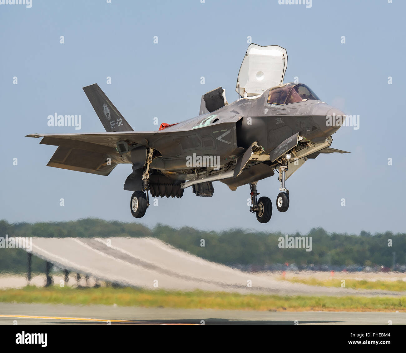 Royal Navy Cmdr. Nathan Gray and U.S. Marine Corps Maj. Michael Lippert, both F-35 Pax River ITF test pilots, conduct ski jumps and field carrier landing practices with F-35Bs on Aug. 28, 2018, at NAS Patuxent River as part of the workups for the First of Class Flight Trials aboard the HMS Queen Elizabeth.  Around 200 supporting staff from the ITF, including pilots, engineers, maintainers and data analysts, will take two F-35Bs test aircraft aboard HMS Queen Elizabeth this fall to evaluate the fifth-generation aircraft performance and integration with Royal Navy’s newest aircraft carrier. This Stock Photo