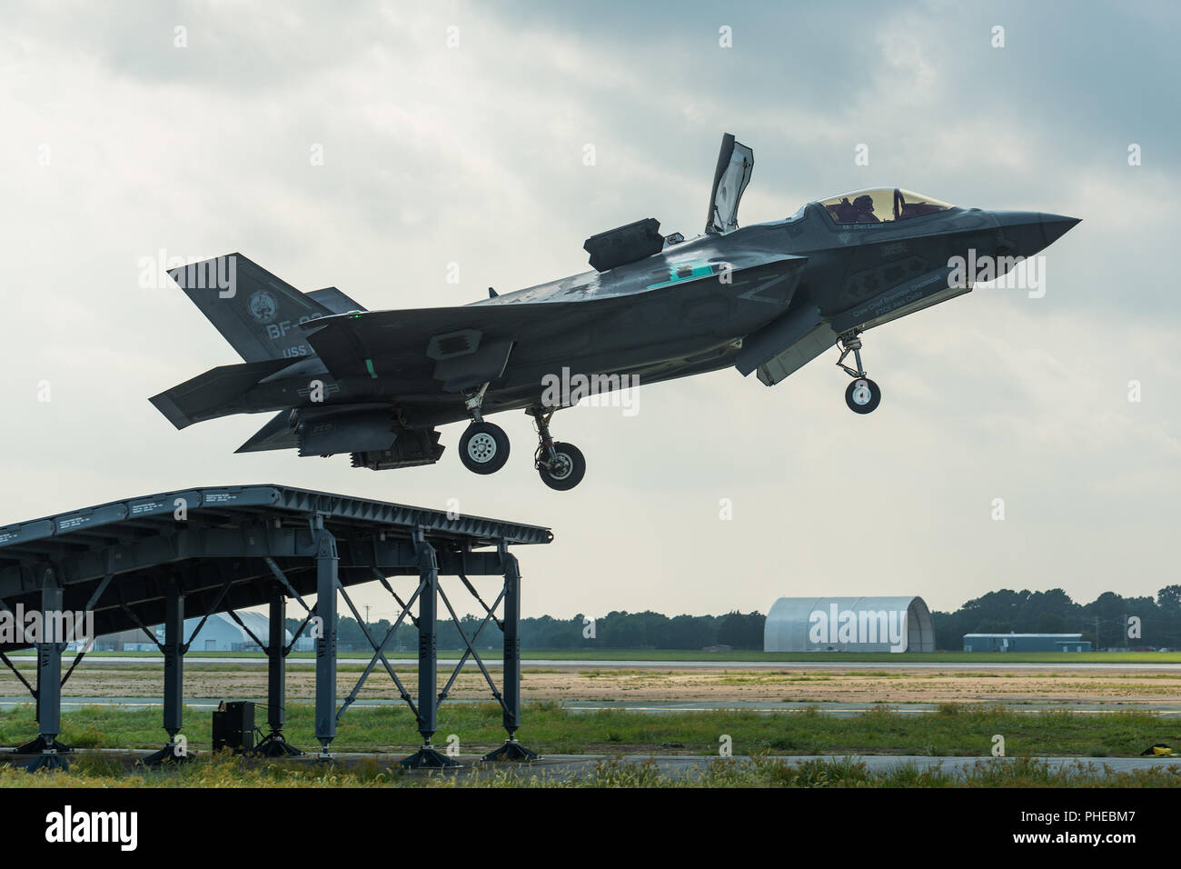 U.S. Marine Corps Maj. Michael Lippert and Royal Air Force Sq. Ldr. Andy Edgell, both F-35 Pax River ITF test pilots, conduct ski jumps and field carrier landing practices with F-35Bs on Aug. 27, 2018, at NAS Patuxent River as part of the workups for the First of Class Flight Trials aboard the HMS Queen Elizabeth.  Around 200 supporting staff from the ITF, including pilots, engineers, maintainers and data analysts, will take two F-35Bs test aircraft aboard HMS Queen Elizabeth this fall to evaluate the fifth-generation aircraft performance and integration with Royal Navy’s newest aircraft carri Stock Photo