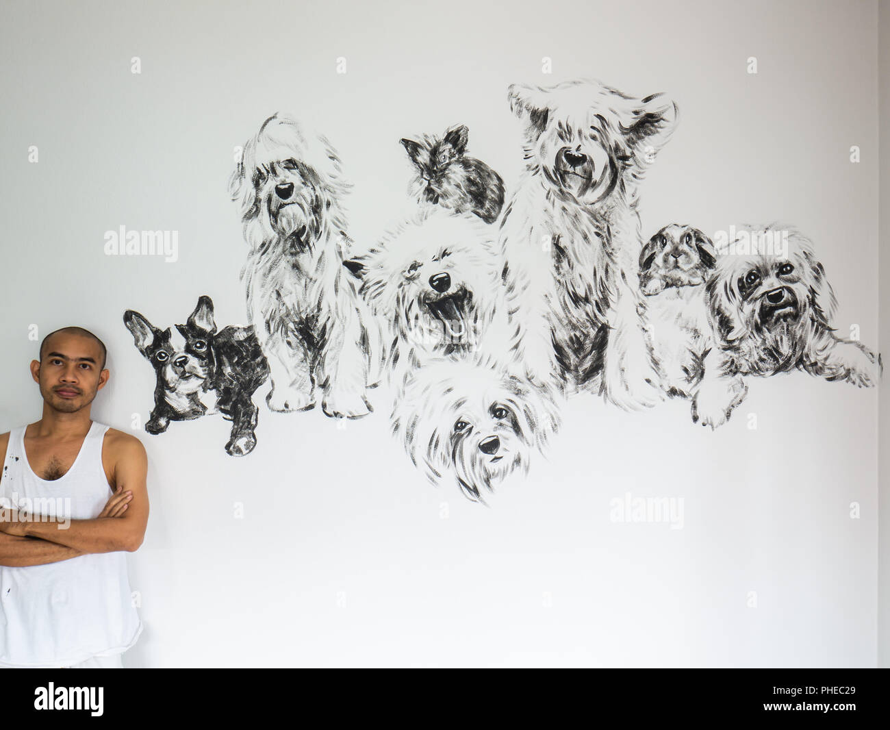 Painter artist with painting group of dogs with rabbit, black and white ...