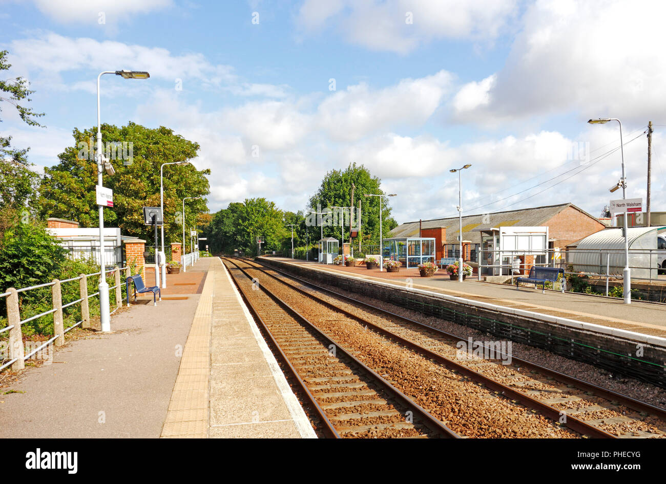 A view of the platforms and passenger waiting areas on the unmanned railway station at North Walsham, Norfolk, England, United Kingdom, Europe. Stock Photo