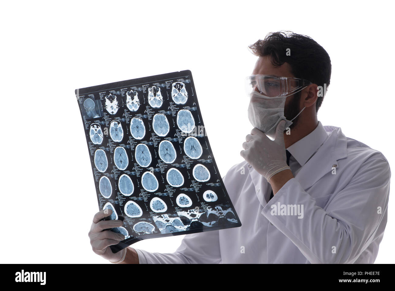 Young doctor looking at x-ray images isolated on white Stock Photo - Alamy