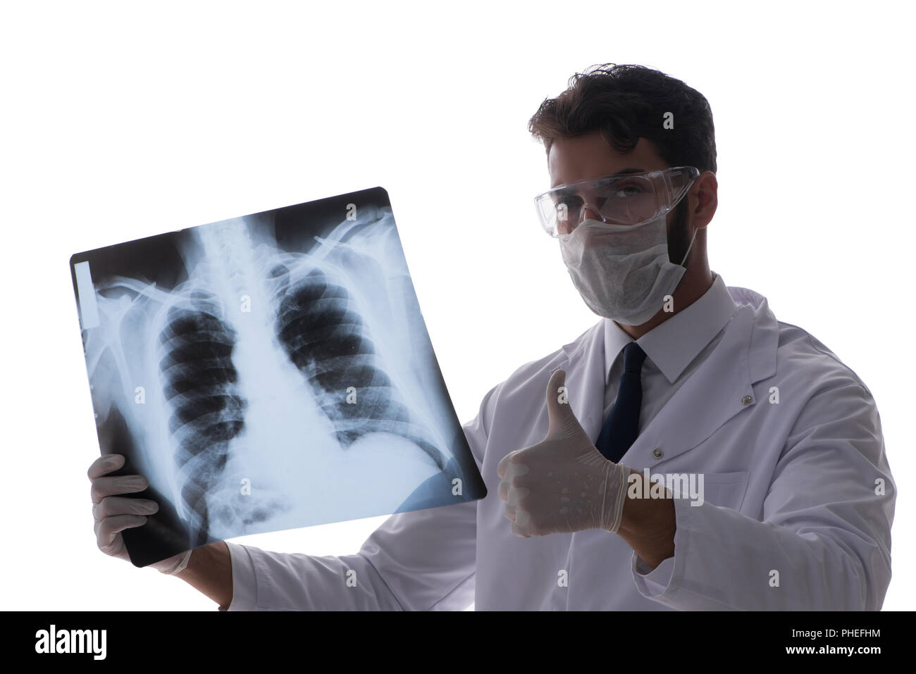 Young doctor looking at x-ray images isolated on white Stock Photo