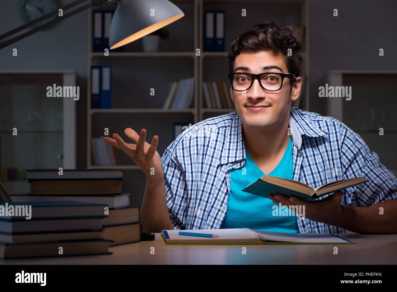 Student preparing for exams late night at home Stock Photo - Alamy