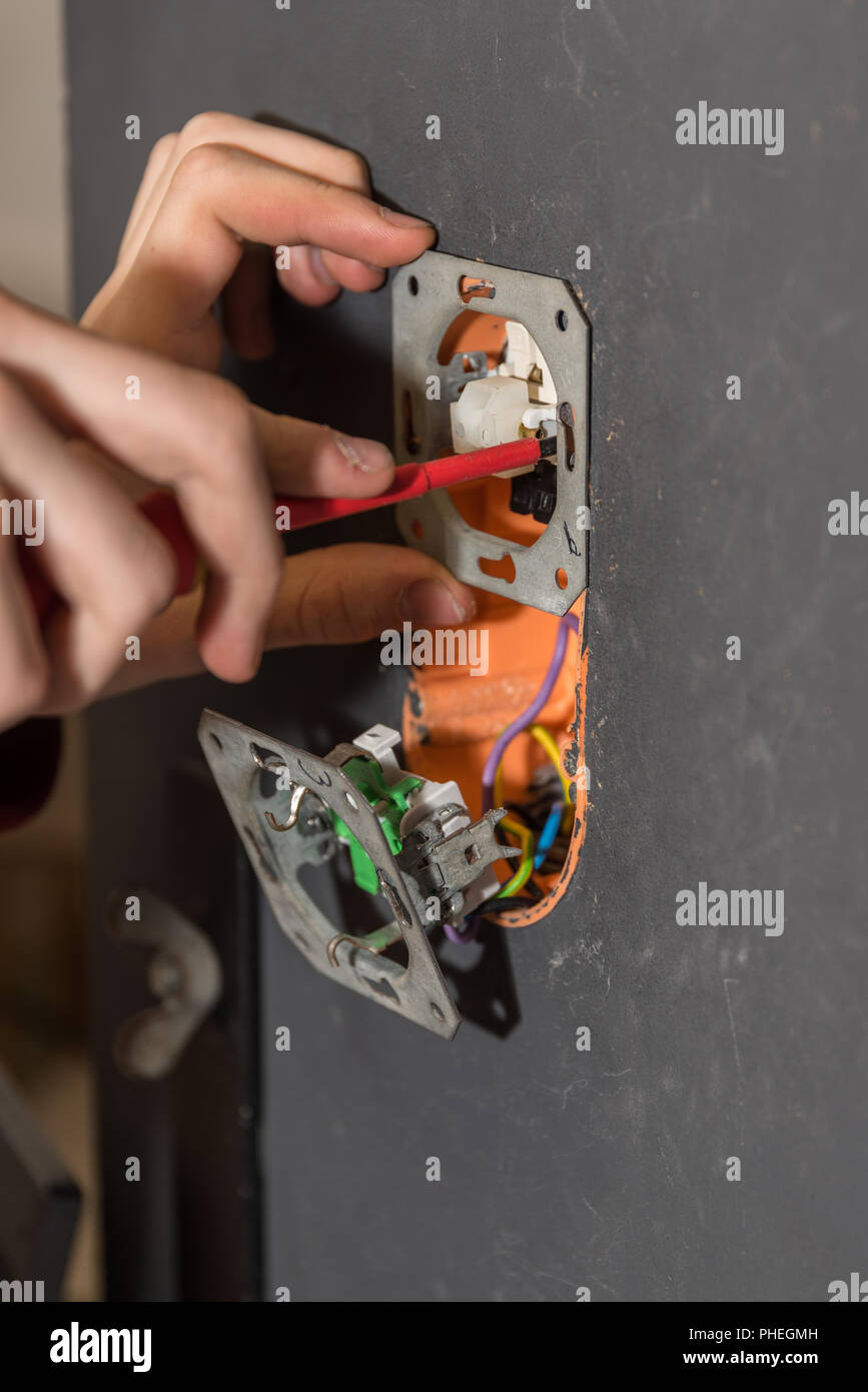 Installer screws with screwdriver circuits Stock Photo