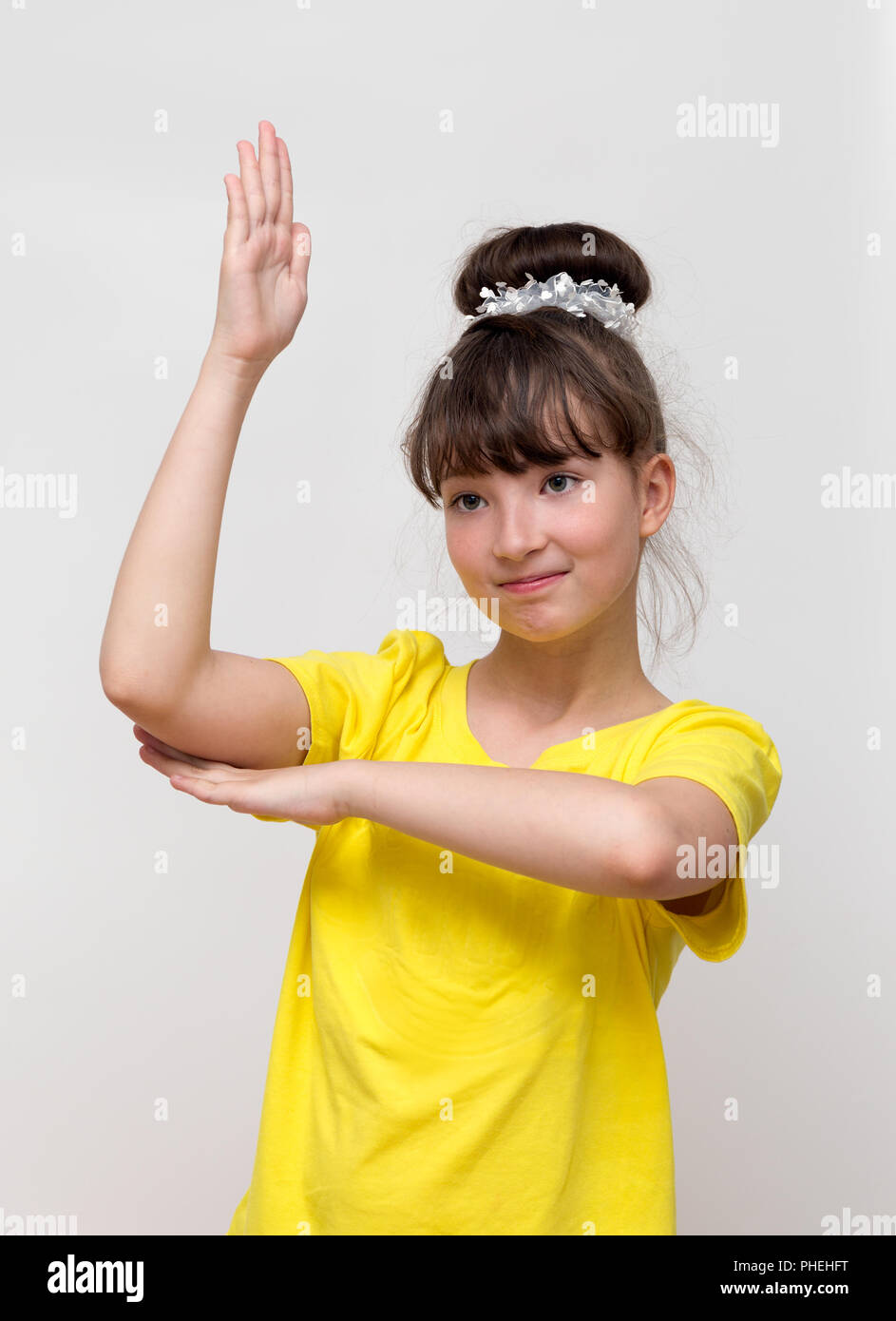Girl raises his hand up Stock Photo