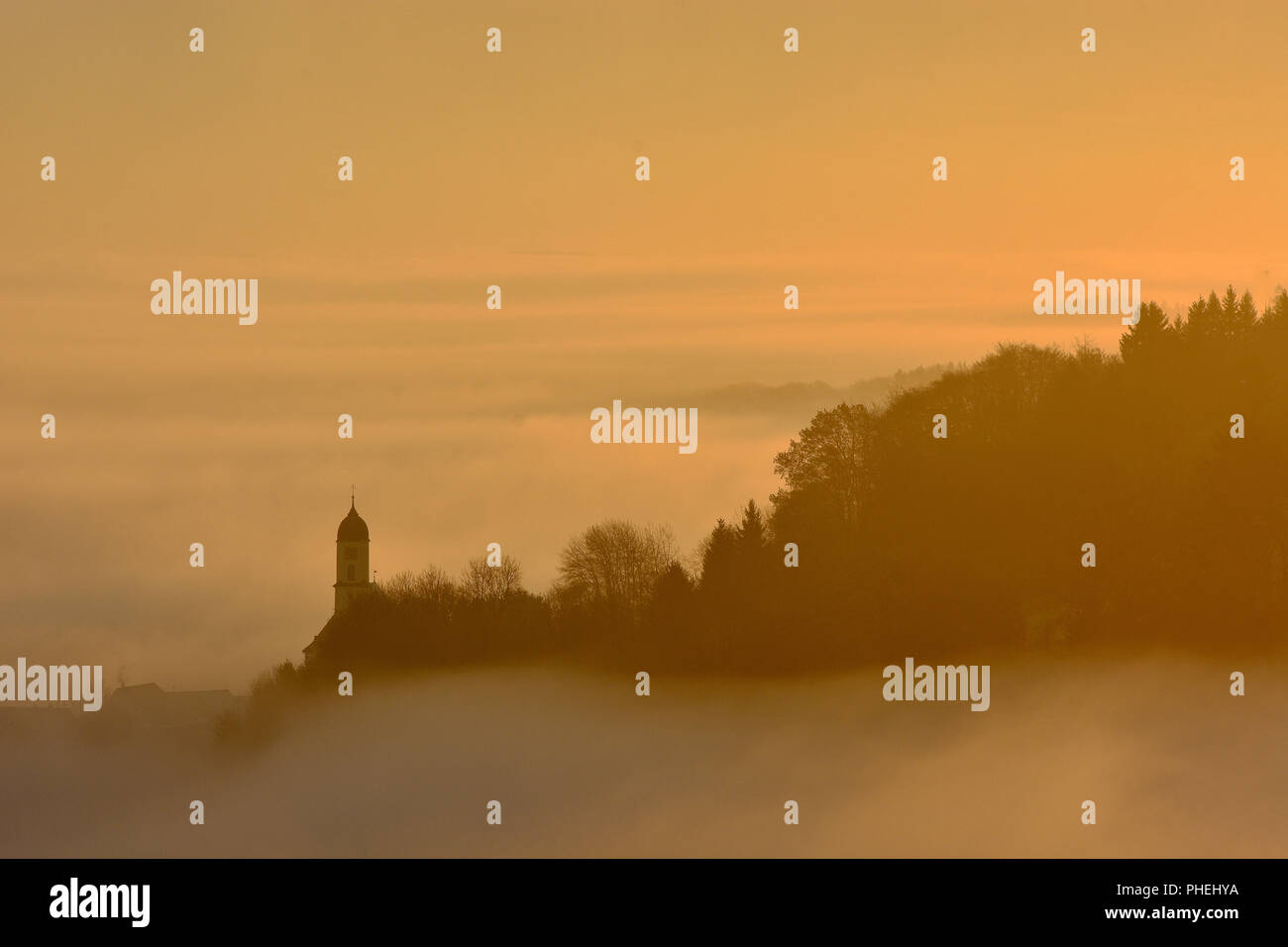 fog; church tower; swabian alb; Germany; Stock Photo