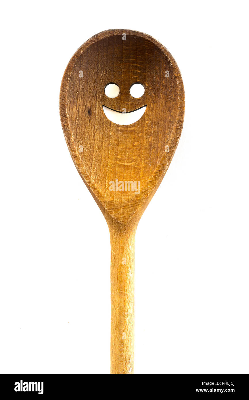 Wooden smiley face spoon on white background Stock Photo - Alamy
