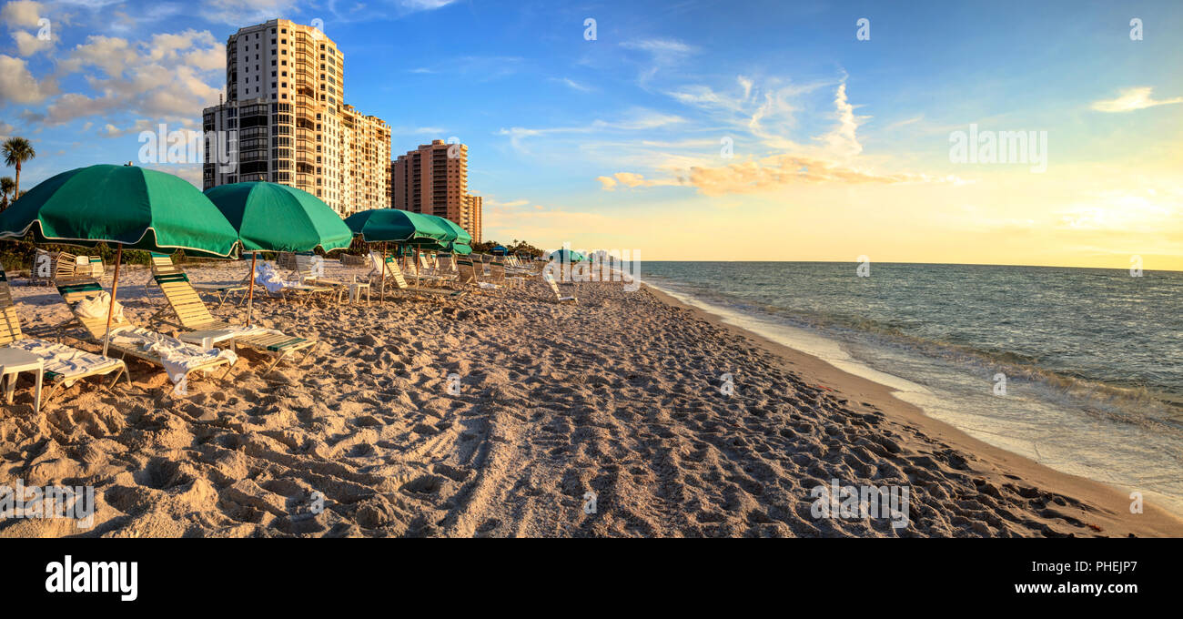 Umbrellas along Vanderbilt Beach in Naples, Florida Stock Photo