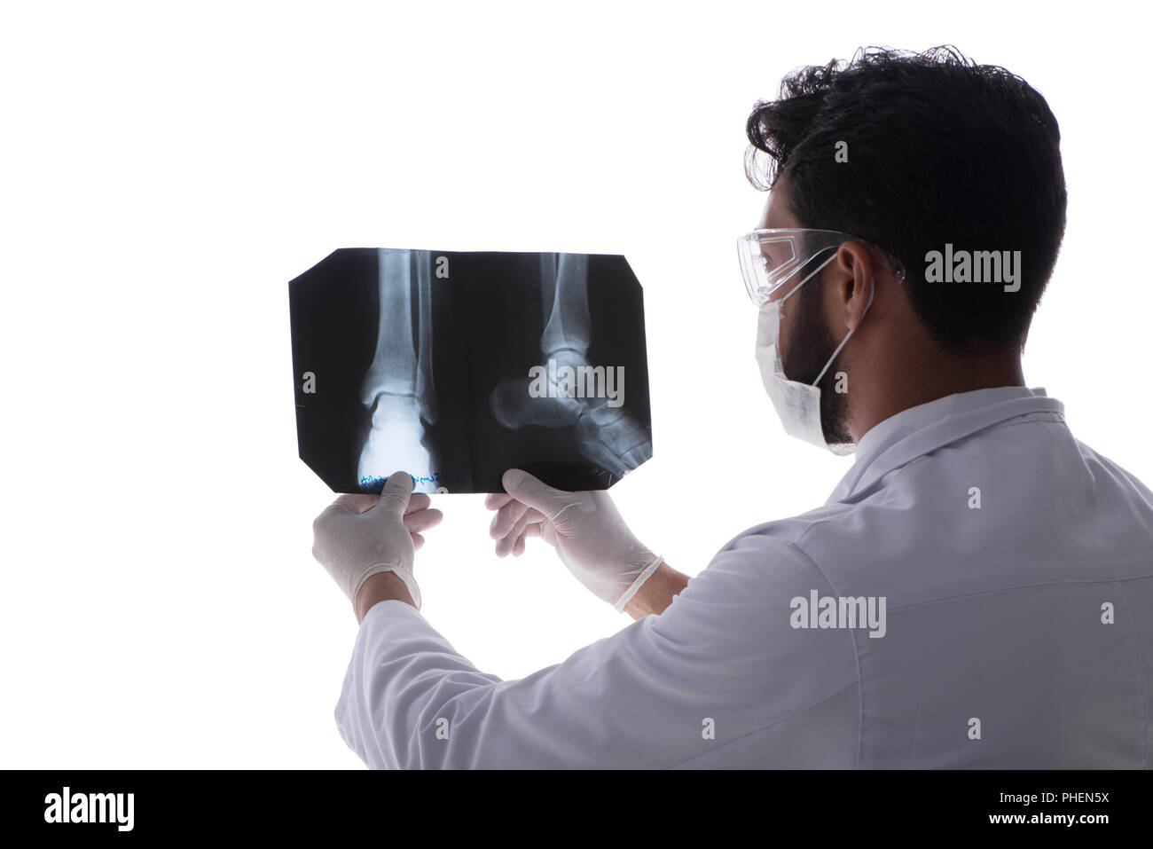 Young doctor looking at x-ray images isolated on white Stock Photo - Alamy