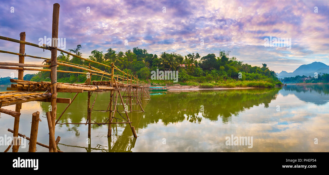 Beautiful view of a bamboo bridge. Laos landscape. Panorama Stock Photo
