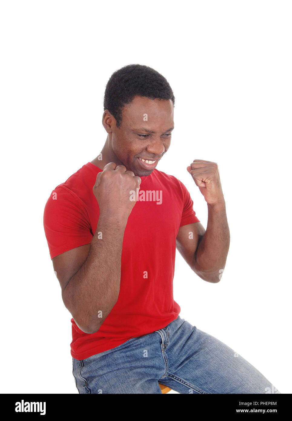 Happy African man with fists, smiling Stock Photo