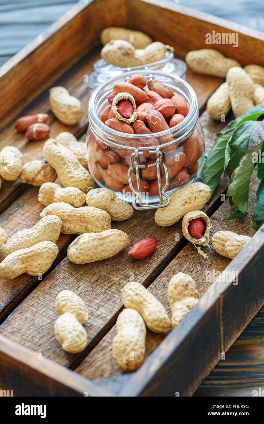 Glass jar with peeled peanuts Stock Photo Alamy