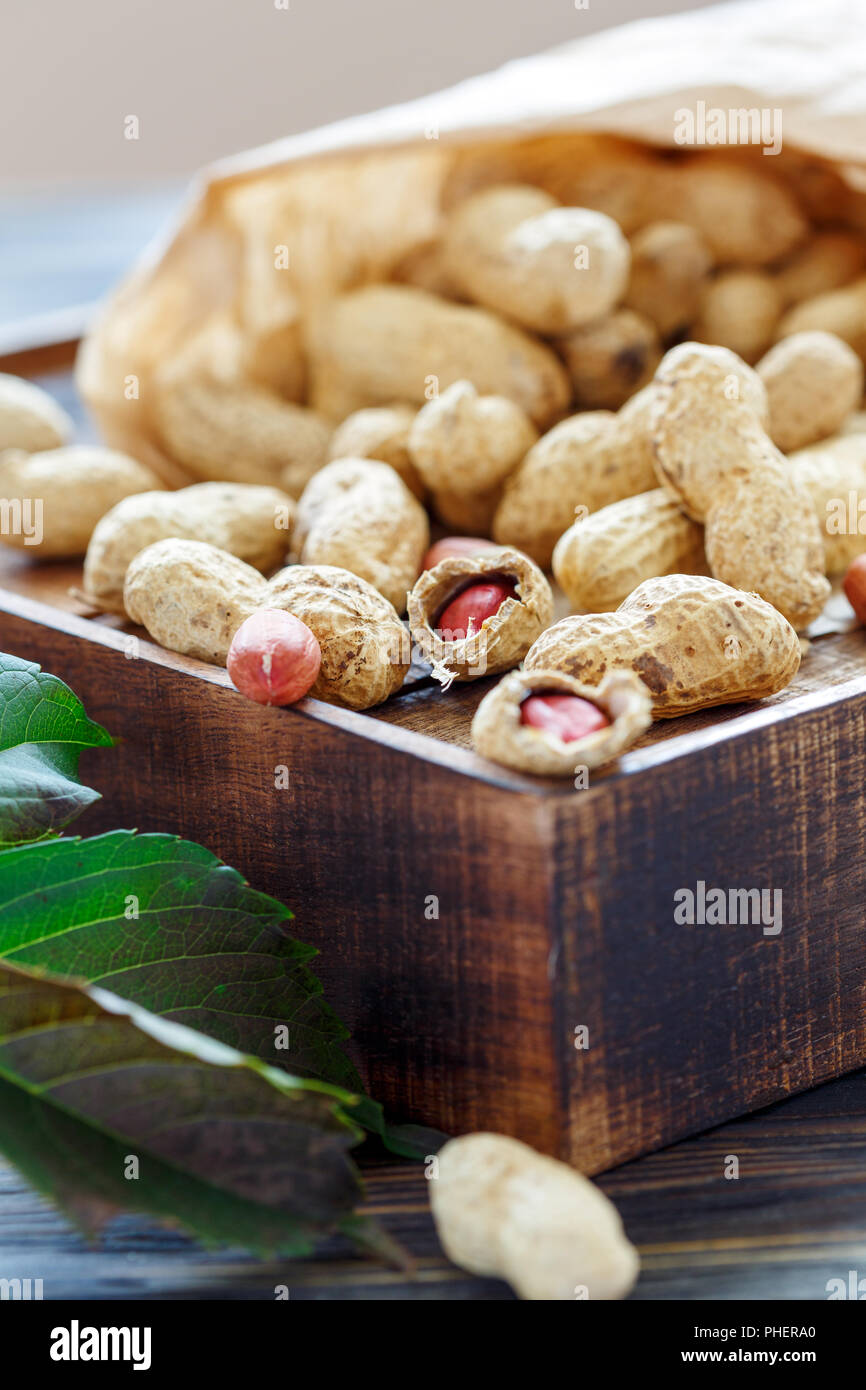 Unshelled peanuts in a paper bag. Stock Photo