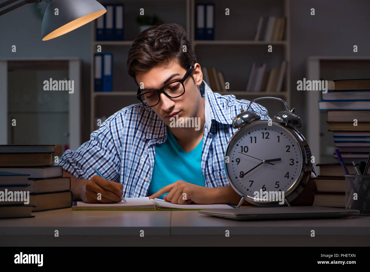 Student preparing for exams late night at home Stock Photo - Alamy