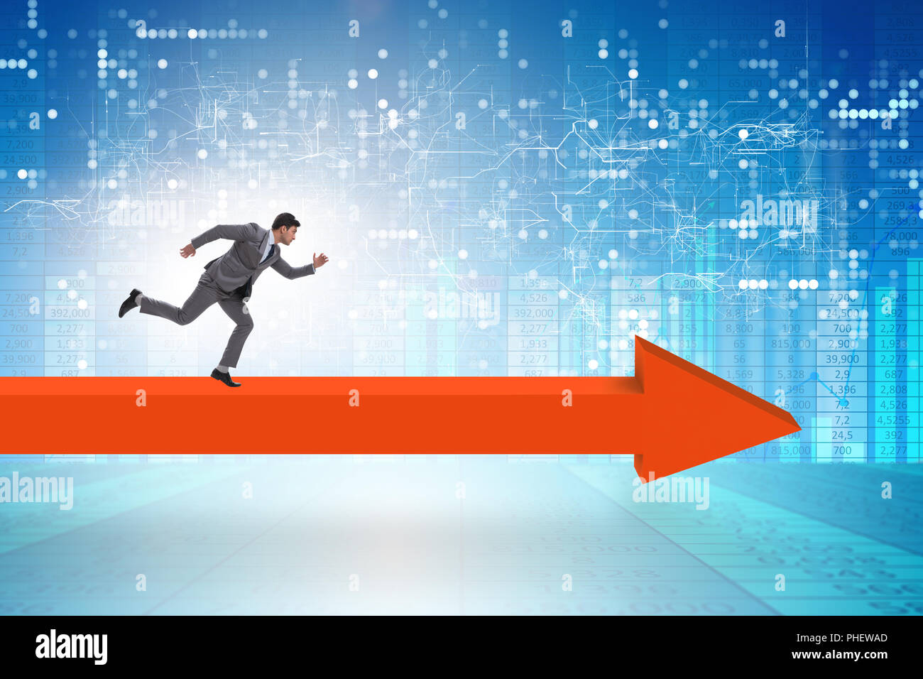 Businessman walking on arrow in business concept Stock Photo - Alamy