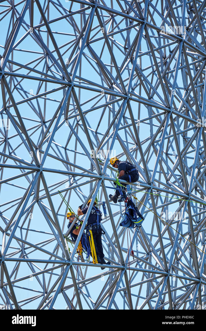Construction workers doing maintenance job on the steel bars of the