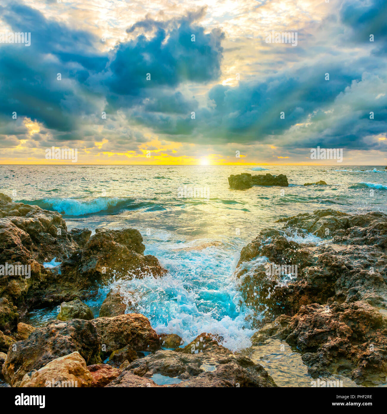 Sunset on the beach Stock Photo - Alamy