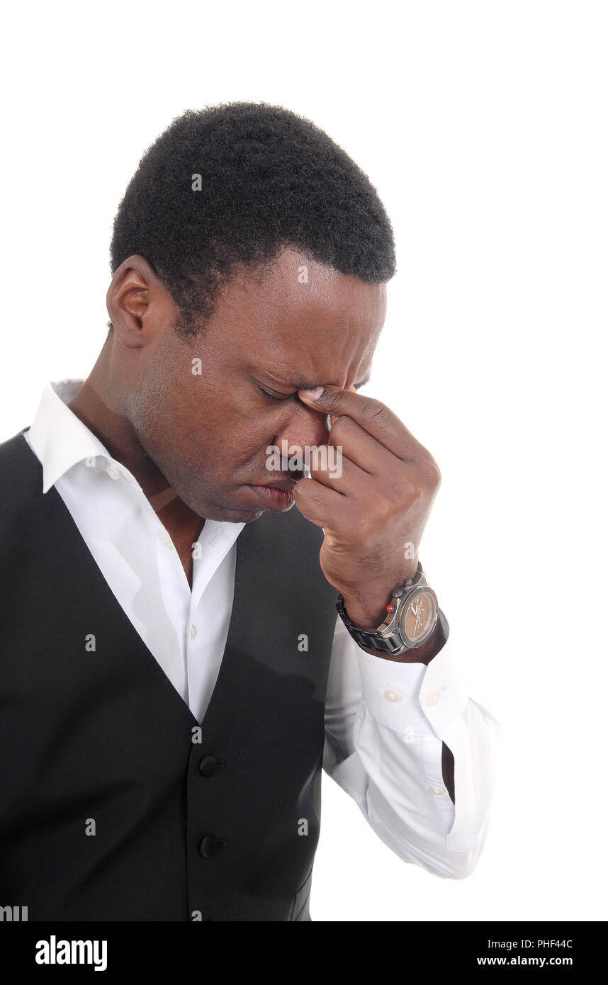 Depressed African man with hand on face Stock Photo