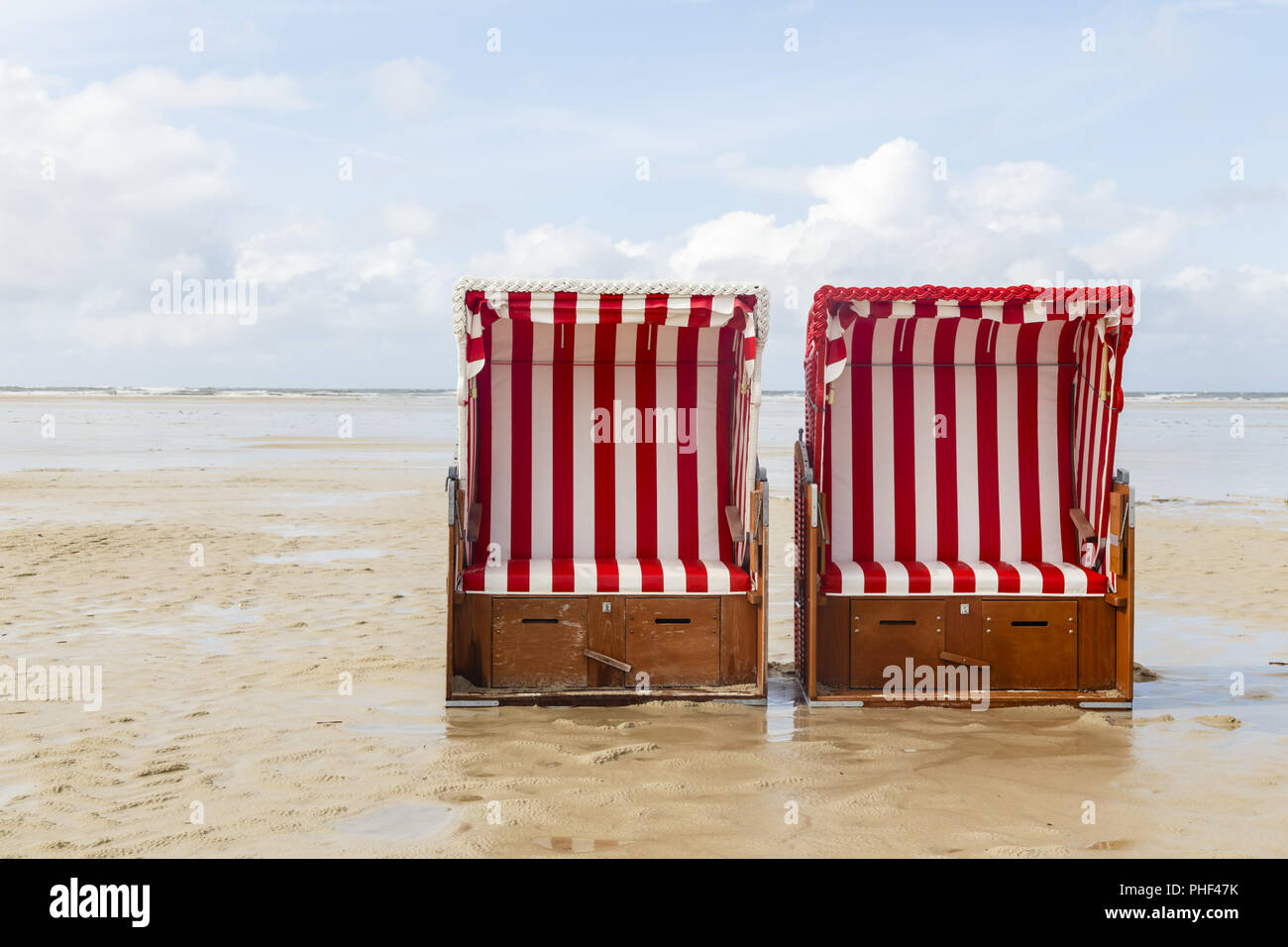Beach Chairs And High Tide On Amrum Germany Stock Photo