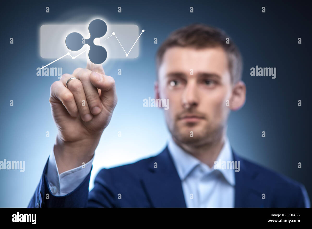 business man touches a ripple icon Stock Photo