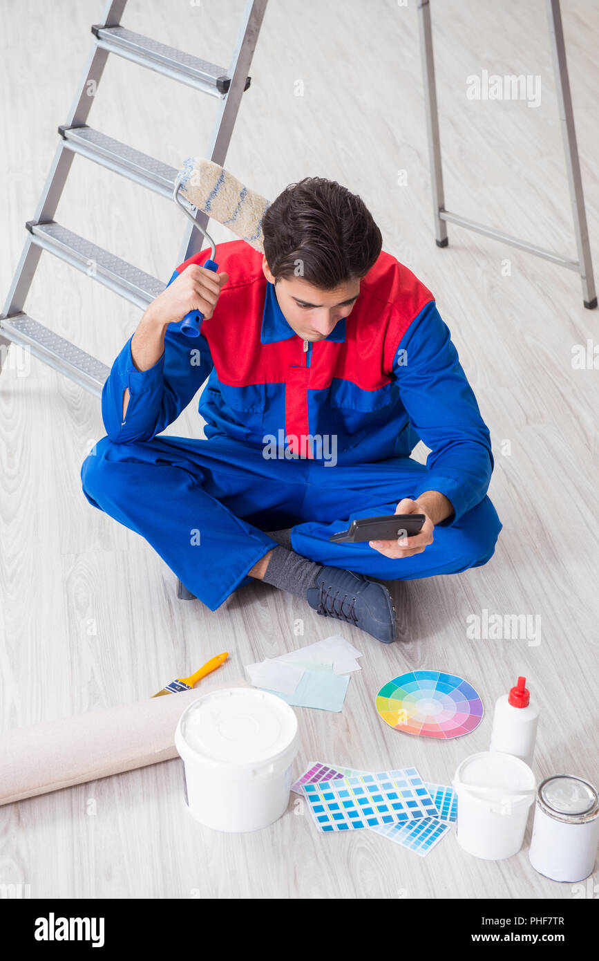 Young painter trying to match colours for painting job Stock Photo Alamy